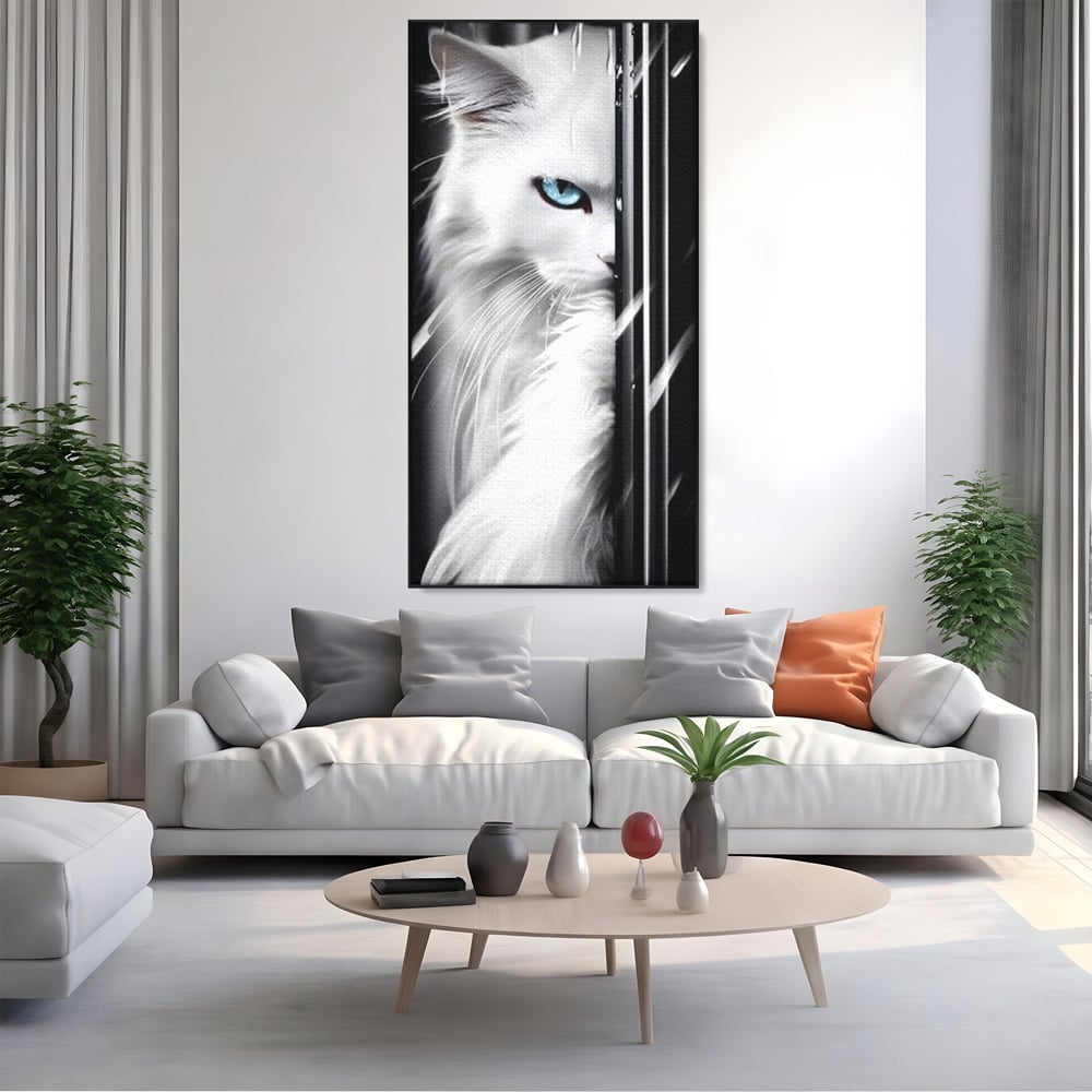 Tablou canvas cu tablou canvas cu pisica alba si ochi albastri, in rama de aluminiu negru, pe perete intr-un living